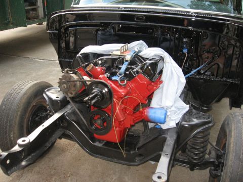 1966 Ford F-100 - Engine and chassis assembly, likely undergoing restoration or re-assembly.