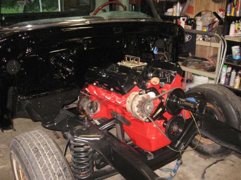 1966 Ford F-100 - The engine is installed in the chassis of a vehicle that appears to be undergoing restoration.