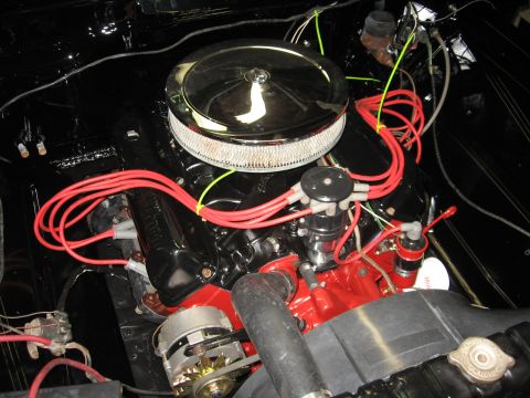 1966 Ford F-100 - Close-up view of a vehicle's engine compartment, showing various components and wiring.