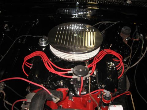 1966 Ford F-100 - Close-up view of a vehicle's engine bay, showing various components and wiring.
