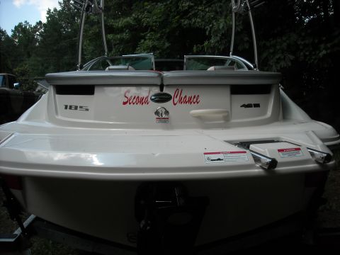 1979 Ford F-150 - The rear of a boat shows the name 'Second Chance' and model designations.