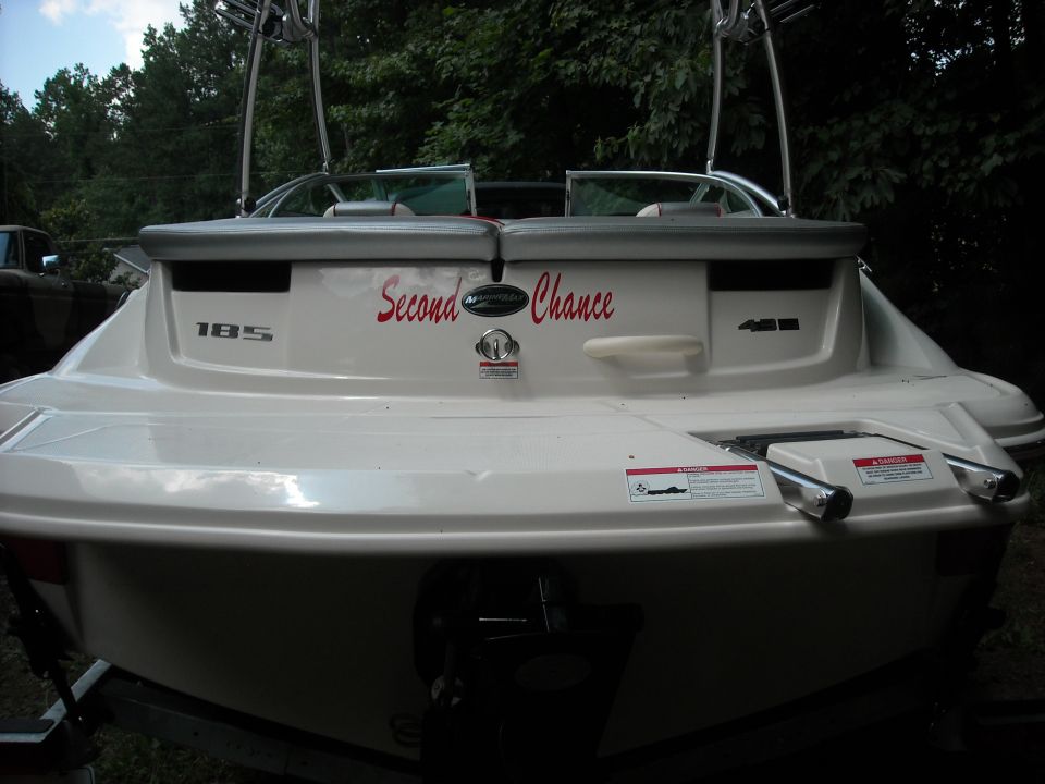 Stern of a white boat with 'Second Chance' in red script, model number 185, and 4.3L designation
