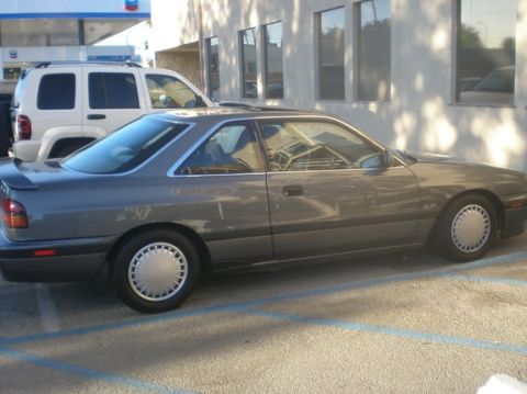 1989 Mazda MX-6 - This 1989 Mazda MX-6 is seen from the side, a sunroof and a spoiler.