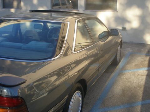 1989 Mazda MX-6 - This 1989 Mazda MX-6 coupe is seen from the rear quarter angle in a parking lot.