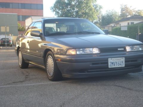 1989 Mazda MX-6 - This 1989 Mazda MX-6 coupe is captured in a 3/4 front view, its distinctive body style.