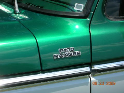 1979 Ford F-100 - The F-100 Ranger emblem is clearly visible on the side of this green truck.