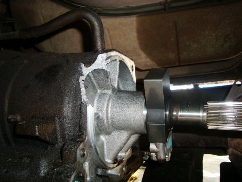 1986 Ford Bronco - This image shows a close-up view of a transmission output shaft seal being installed.