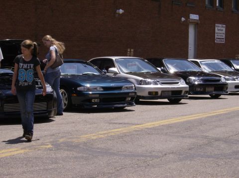 1970 Ford Ranchero - Cars lined up at an outdoor car show with spectators milling about.