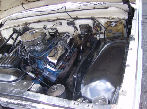 1970 Ford Ranchero - Close-up view of a V8 engine in a vehicle's engine bay.