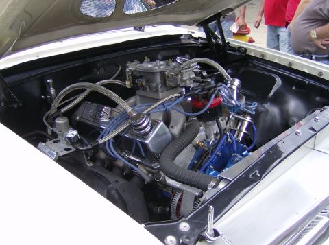 1970 Ford Ranchero - Close-up view of a modified V8 engine bay, showing custom components and wiring.