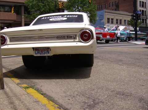 1970 Ford Ranchero - 1964 Ford Galaxie 500 seen from the rear, with 'CRUISIN' Michigan plate and 'ALCOHOL ABUSE Ford' sticker.