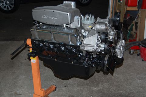 1994 Ford Bronco - V8 engine on an engine stand, showing the Edelbrock intake and valve covers.