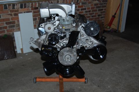 1994 Ford Bronco - A V8 engine is mounted on an engine stand, ready for installation or work.