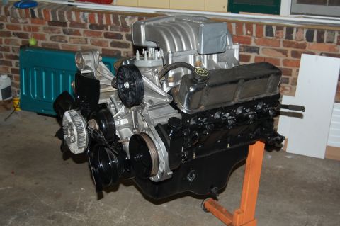 1994 Ford Bronco - Engine assembly on an orange stand, showing the front and side components.