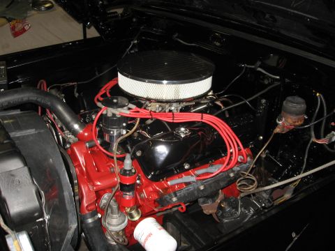 1966 Ford F-100 - Engine bay details with a chrome air cleaner and red painted engine block.