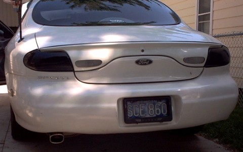 1997 Ford Taurus - 1997 Ford Taurus sedan, rear view. Michigan plate SCE 860.