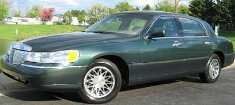 1988 Mercury Grand Marquis - This green sedan is shown from a 3q front angle, with a watermark from SUPERMOTORS.NET visible.
