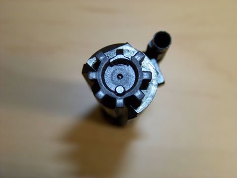 1995 Mercury Grand Marquis - This is a close-up view of a firearm bolt, not a vehicle part.