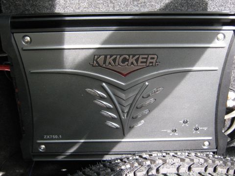 1997 Ford Crown Victoria - A Kicker ZX750.1 car audio amplifier is shown, likely installed in a vehicle's trunk.