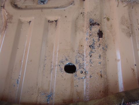 1983 Ford Bronco - NOT following my own advice, I didn't trace the cover plate onto the floor first. This first hole is placed correctly. Using a hole saw lea…