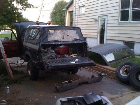 1988 Ford Bronco - This Bronco appears to be undergoing some form of modification or repair, with its soft top deployed and hardtop removed.
