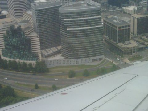 1996 Ford Bronco - An aerial perspective captures a cityscape contemporary architecture and a busy highway below.