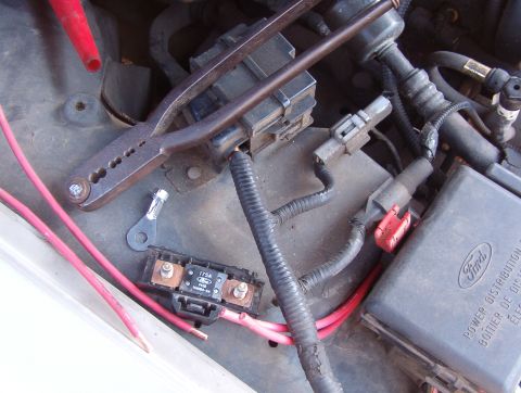 1994 Ford Crown Victoria - I'm crimping these ring terminals onto the doubled wire before soldering them. For now, the MegaFuse holder will just rest here. Later, I'l…