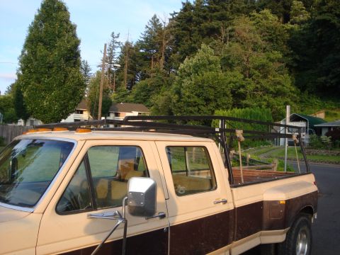 1988 Ford F-350 - This Ford F-350 pickup truck features a two-tone paint scheme and a roof rack.