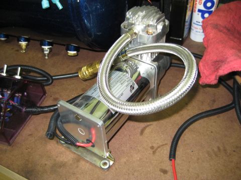 1996 Chevrolet Cavalier - Close-up of an air compressor and associated fittings, likely for an air ride system.