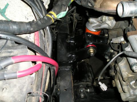 1986 Toyota Hilux - Custom engine mounts installed in the engine bay, with visible wiring and hoses.