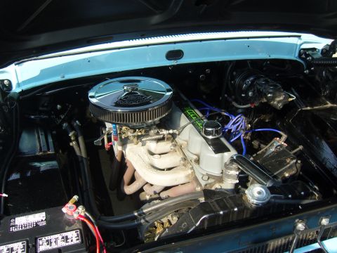 2007 Ford Mustang - Close-up view of a modified V8 engine bay, custom chrome and blue wiring.