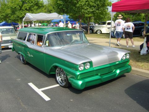 2007 Ford Mustang - Customized station wagon with a two-tone paint job and aftermarket wheels on display.