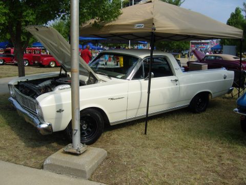 2007 Ford Mustang - A white 1966 Ford Ranchero is displayed with its hood open at an outdoor event.