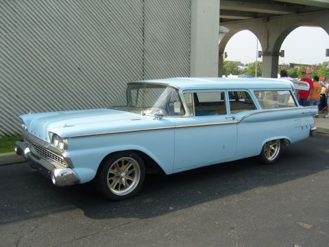 2007 Ford Mustang - A classic light blue 1959 Ford station wagon is parked outdoors, showing its distinctive body style and chrome accents.