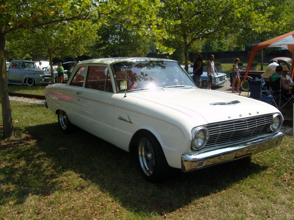 White 1960 Ford Falcon sedan with chrome grille and hood scoop