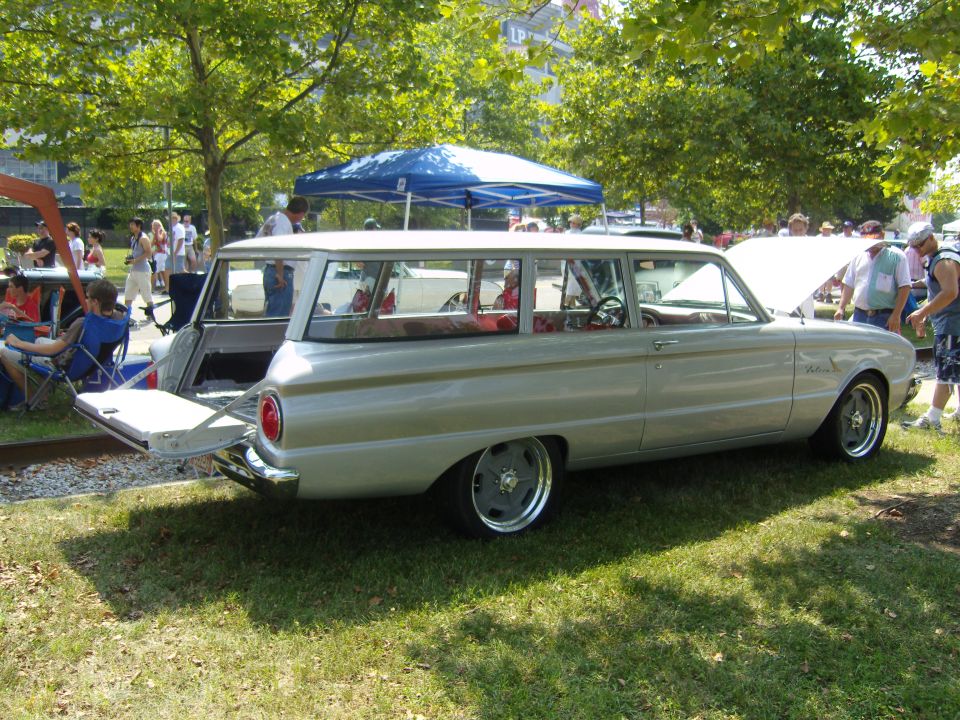 Silver 1963 Ford Falcon station wagon with lowered suspension and custom wheels, tailgate open