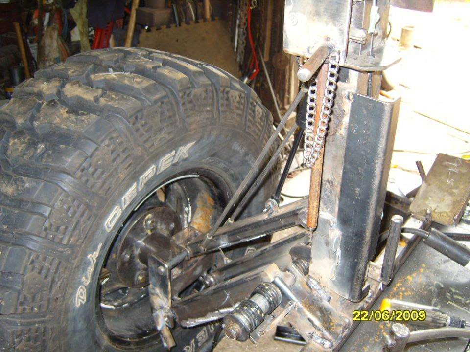 Rear suspension and large tire with 'Dick Cepek' text