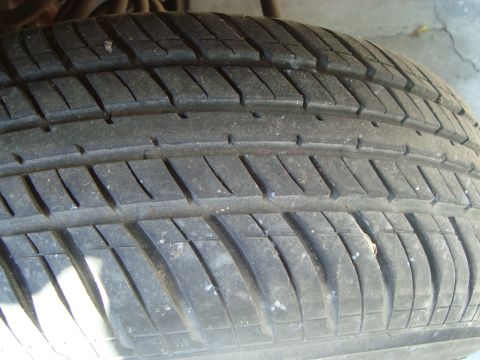 1986 Ford Bronco - A close-up view of a tire tread, the SuperMotors.net logo in the lower right corner.