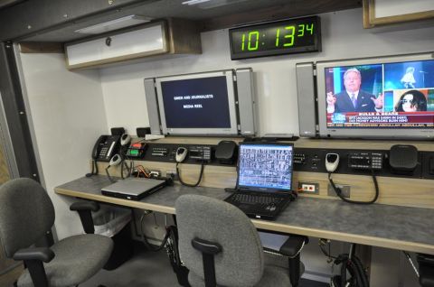 1996 Ford Bronco - Mobile command center interior with communication equipment and screens.
