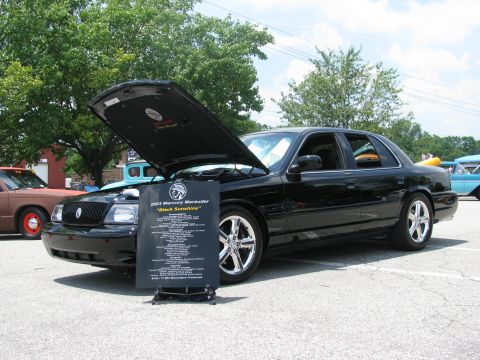 2003 Mercury Marauder - A black 2003 Mercury Marauder is displayed with its hood open at an outdoor event.