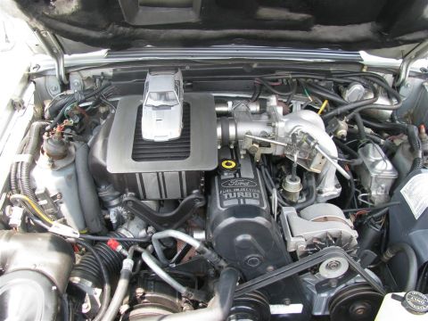 2003 Mercury Marauder - Engine bay detail with a toy car placed on top of the intercooler cover.