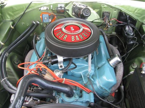 2003 Mercury Marauder - Close-up view of a vehicle's engine bay, showing the engine block and air cleaner assembly.
