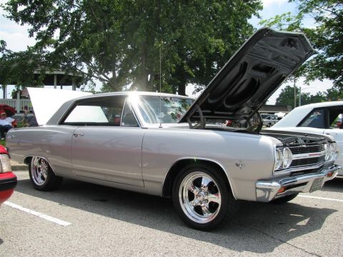 2003 Mercury Marauder - A silver 1966 coupe is displayed with both hoods open at a car show.
