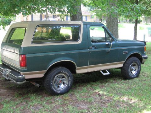 1989 Ford Bronco - This 1989 Ford Bronco is shown from the rear three-quarter angle, parked outdoors.