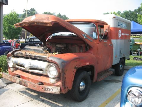 1966 Ford F-100 - This 1956 Ford F-series truck features a U-Haul box body and has its hood open, revealing the engine compartment.