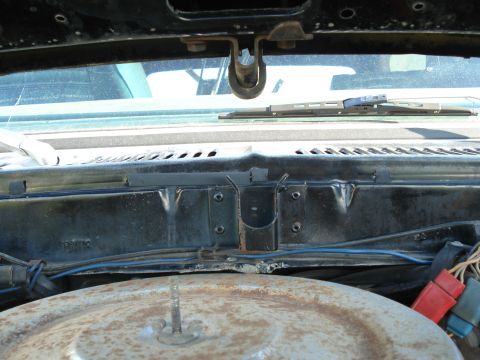 1979 Ford F-150 - View of the under hood area, including the windshield wiper mechanism and air cleaner.