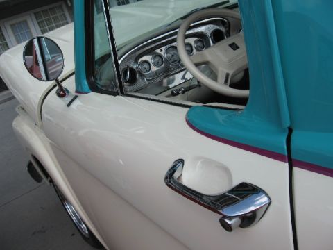 1966 Ford F-100 - Interior view of a 1956 Ford F-100 pickup truck, highlighting the dashboard and door panel.