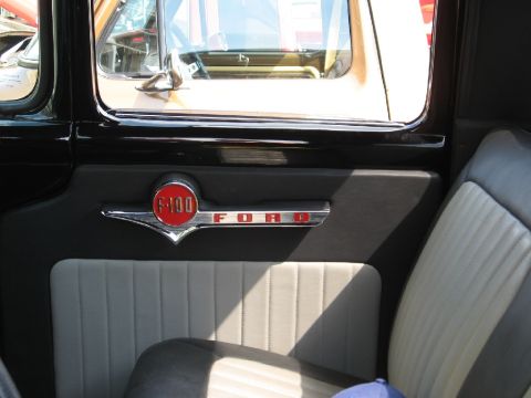1966 Ford F-100 - The interior door panel of a 1966 Ford F-100 features the iconic F-100 and Ford badging.