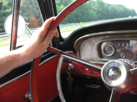 1966 Ford F-100 - Interior view of a 1966 Ford F-100, showing the steering wheel and dashboard.