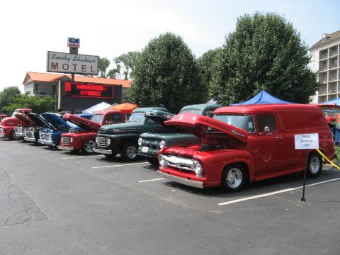 1966 Ford F-100 - Several classic Ford trucks are lined up at the Smoky Shadows Motel for a car show.